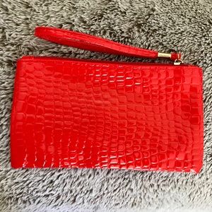 New reptile print wristlet